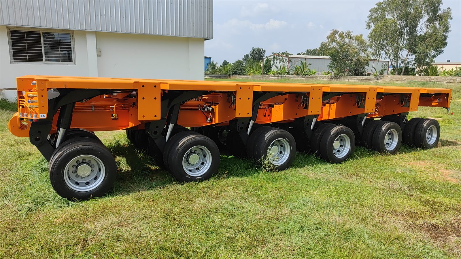 Completed orange modular hydraulic trailers